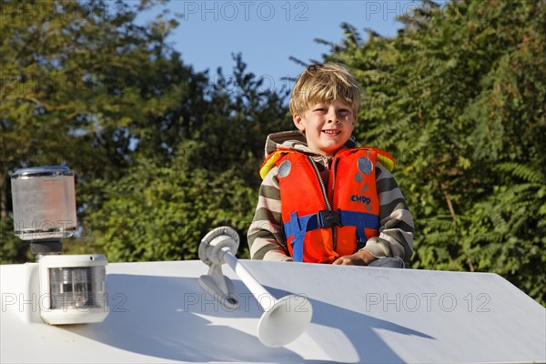 Boy on a houseboat on the Canal du Midi