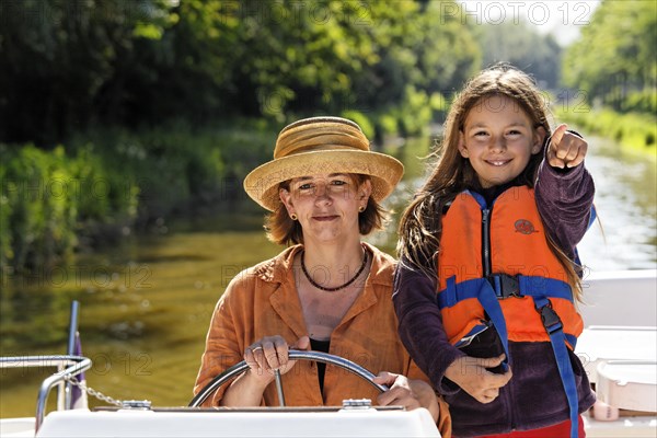 Mother and daughter at the wheel of a Penichette