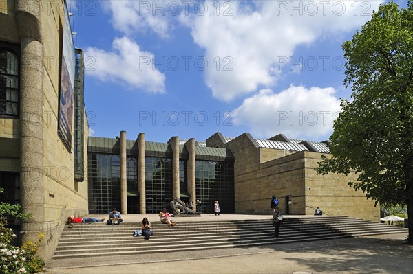 Main entrance of the Neue Pinakothek art gallery with visitors on the stairs