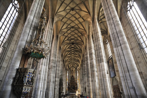 Vaulted ceiling and chancel of the late-gothic three-naved hall church