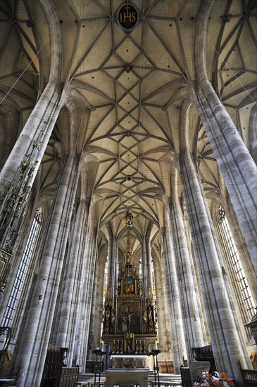 Vaulted ceiling and chancel of the late-gothic three-naved hall church