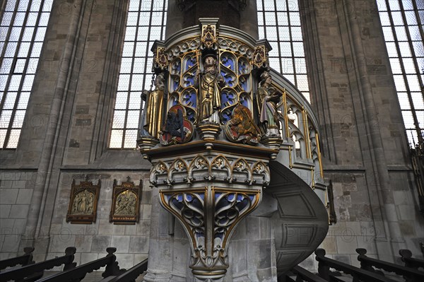 Ornate sandstone pulpit with tracery