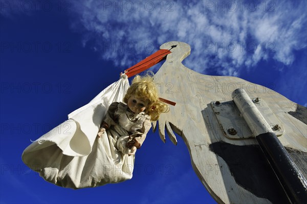 Stork bringing a baby