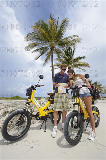 Cyclists with electric bicycles