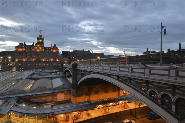 Views of the old town illuminated in the evening with the tower of the Balmoral Hotel