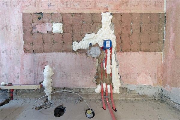 Wall cavities filled with foam insulation