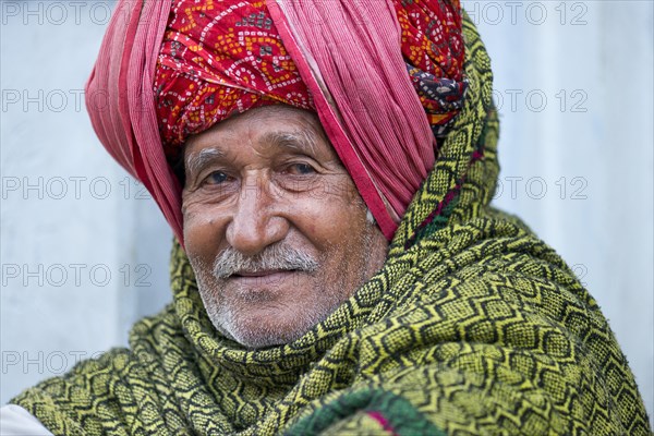 Elderly Indian man with a red turban