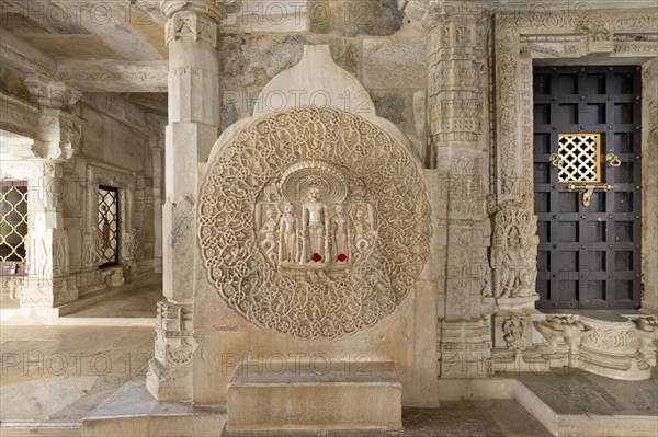 Tirthankar Parshvanat in the medallion protected by the thousand-headed serpent God Dharanendra against a powerful storm