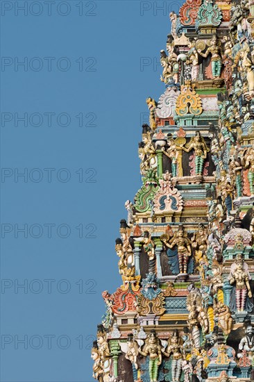 Colourful statues of gods and demons on the Gopuram or Gopura gate tower