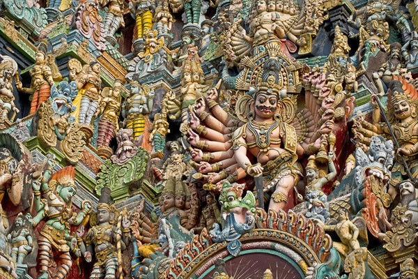 Colourful statues of gods and demons on the Gopuram or Gopura gate tower