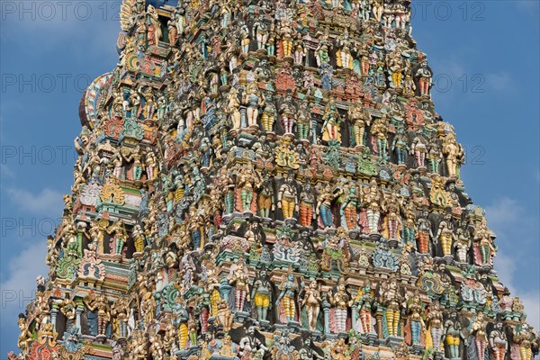 Colourful statues of gods and demons on the Gopuram or Gopura gate tower