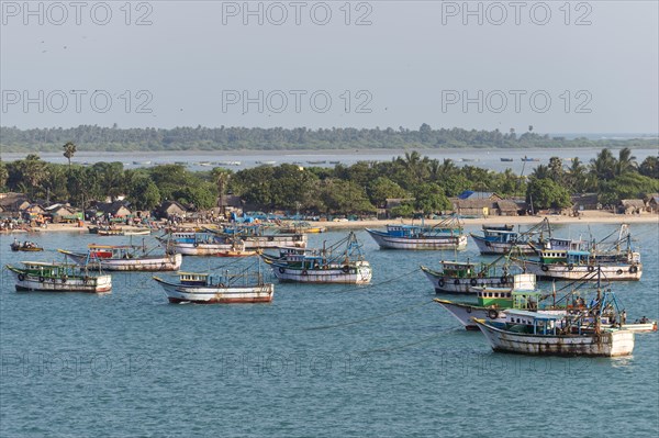 Fishing boats and fishermen's huts on the coast