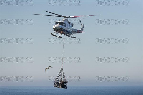 Atlantic Airways helicopter transporting a quad bike