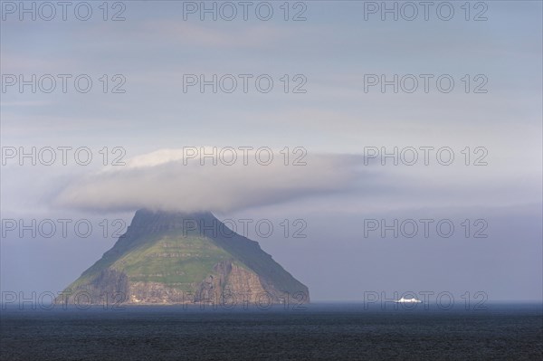 The only uninhabited island of the Faroe Islands with a ferry of the Smyril Line travelling in the Suouroyarfjorour Strait