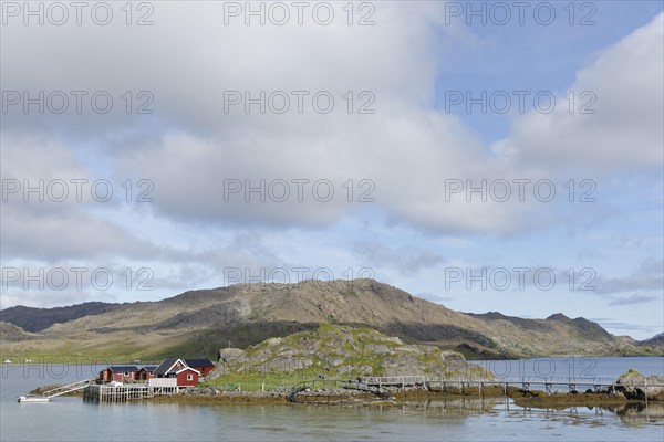 Red wooden houses on the coast