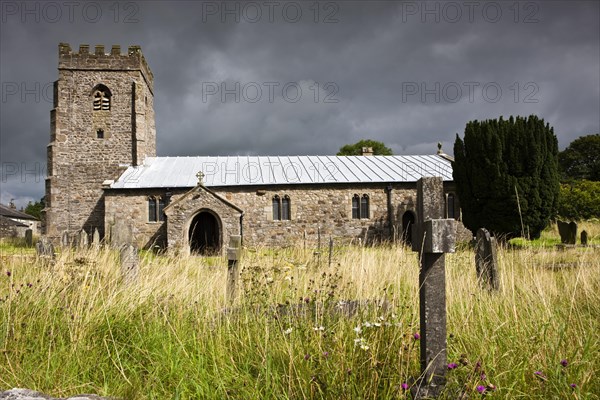 Impending thunderstorm over St. Oswald's Church