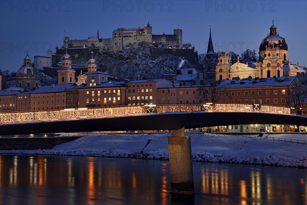 Cityscape of Salzburg by night in winter