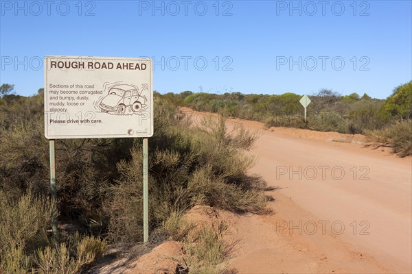 Warning sign 'Rough road ahead'