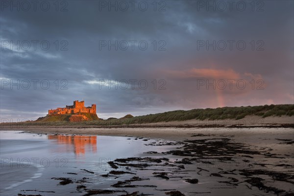 Bamburgh Castle with a rainbow after a storm