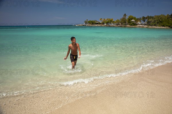 Young Cuban man on Playa Bacuranao beach