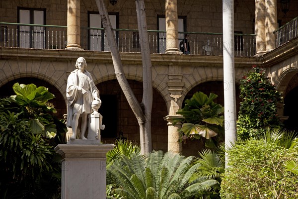 Marble statue of Christopher Columbus in the courtyard of the Palacio de los Capitanes Generales