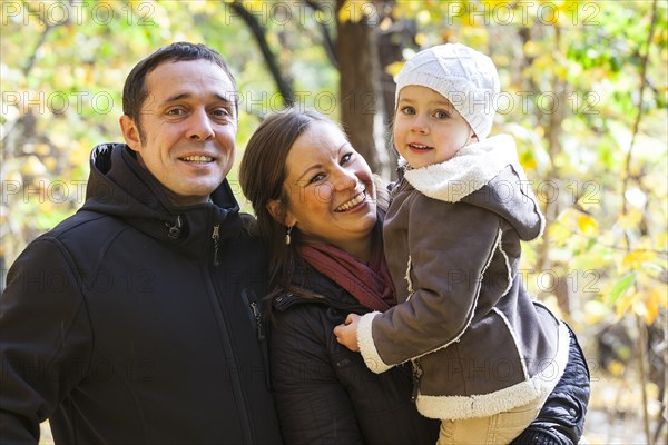 Family in an autumn forest