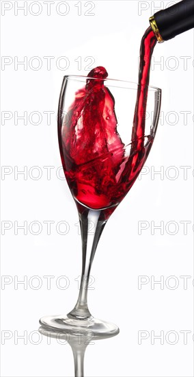 Red wine being poured into a glass