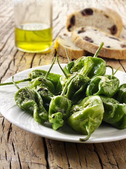 Whole griddled Padron peppers with sea salt