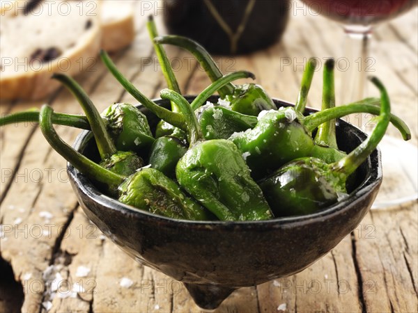 Whole griddled Padron peppers with sea salt