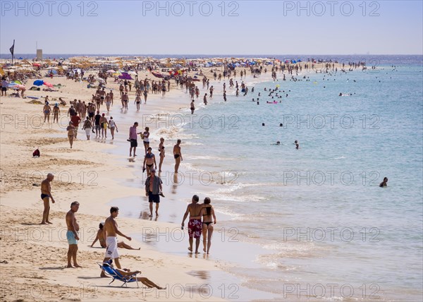 Tourists on the beach of Playa del Matorral