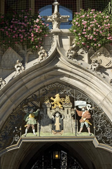 Wrought iron grille with the Muenchner Kindl at the entrance gate