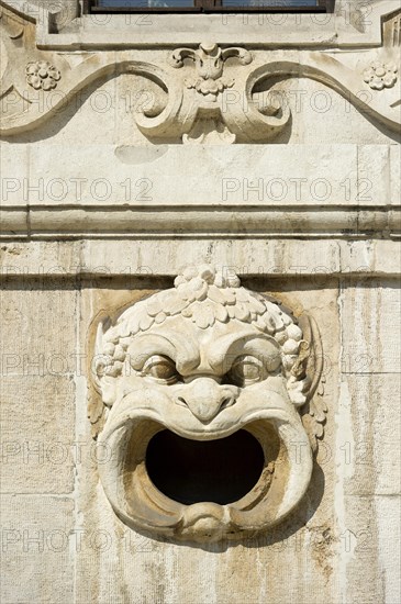 Decorative gargoyle on the outer wall of the Bavarian National Museum