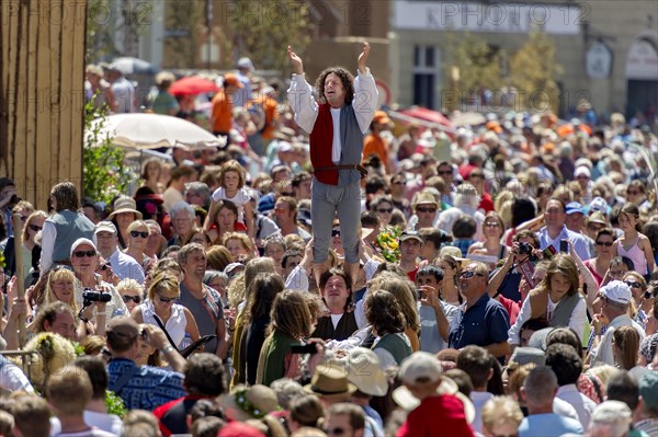 Jugglers and acrobats in a crowd during the 'Landshut Wedding 1475' medieval festival