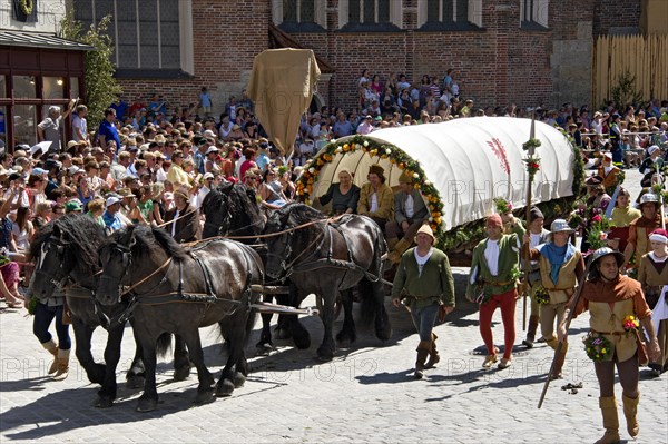 Horse-drawn covered wagon