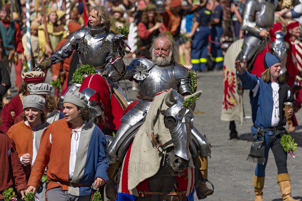 Knights wearing armour on horseback