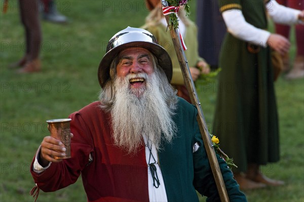 Bailiff holding a cup wearing a medieval costume at the showgrounds