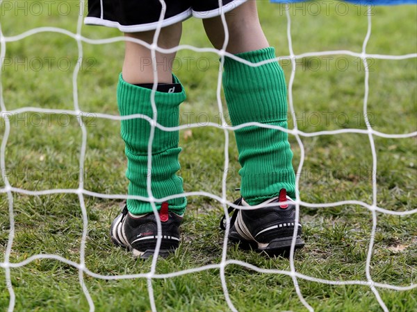 Youth team goalkeeper standing in goal