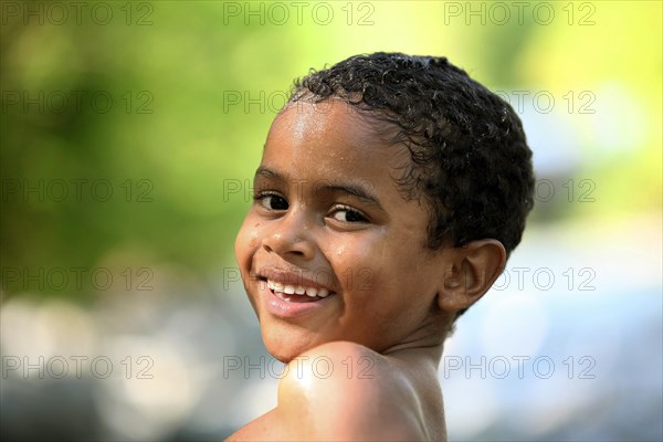 Smiling boy with wet hair