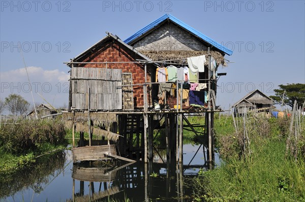 Simple traditional straw house on stilts