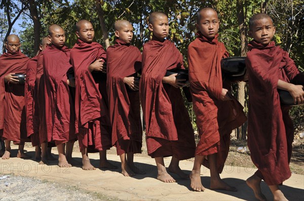 Buddhist monks collecting alms