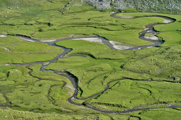 Meandering stream through the Timmelsalm alpine pasture