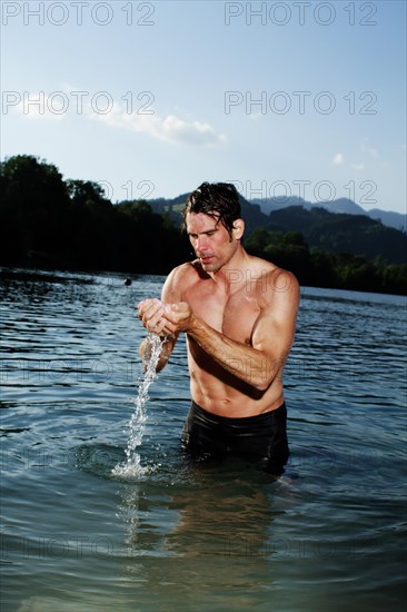 Man standing in a lake in Sonthofen