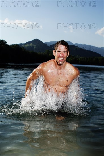 Man standing in a lake in Sonthofen