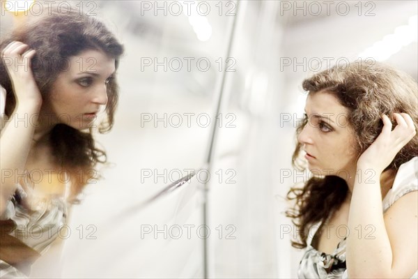 Woman and her mirror image