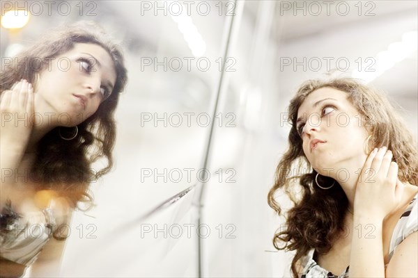 Woman and her mirror image