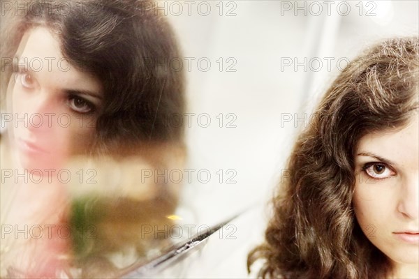 Woman and her mirror image
