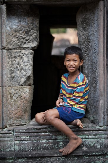 Boy in the temple complex of Preah Khan or Prah Khan