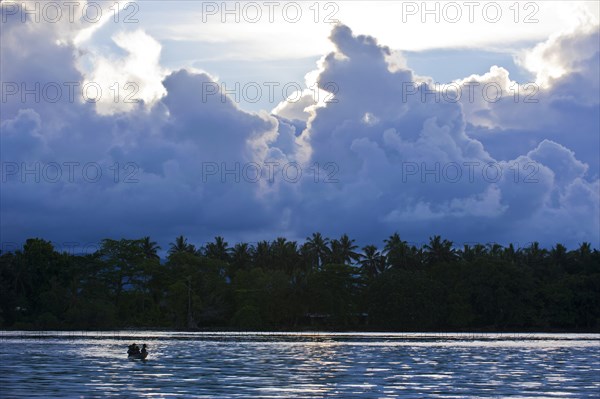 Boys in a canoe in the Marovo Lagoon