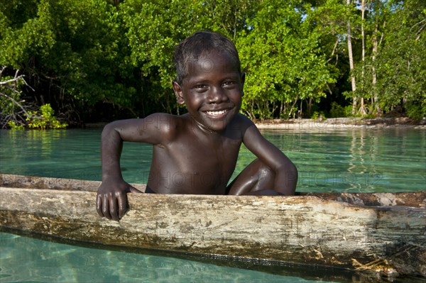 Local boy in a canoe in the Marovo Lagoon