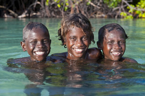 Local boys in the water of the Marovo Lagoon